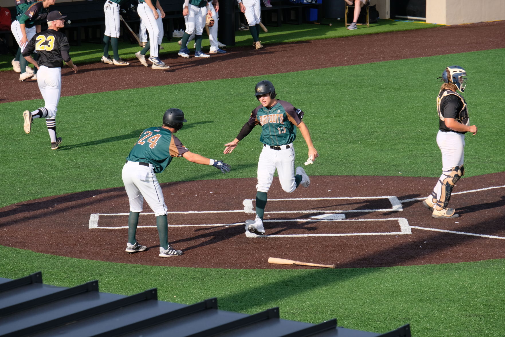 Logan Lex (24) greets David Julian (13)
